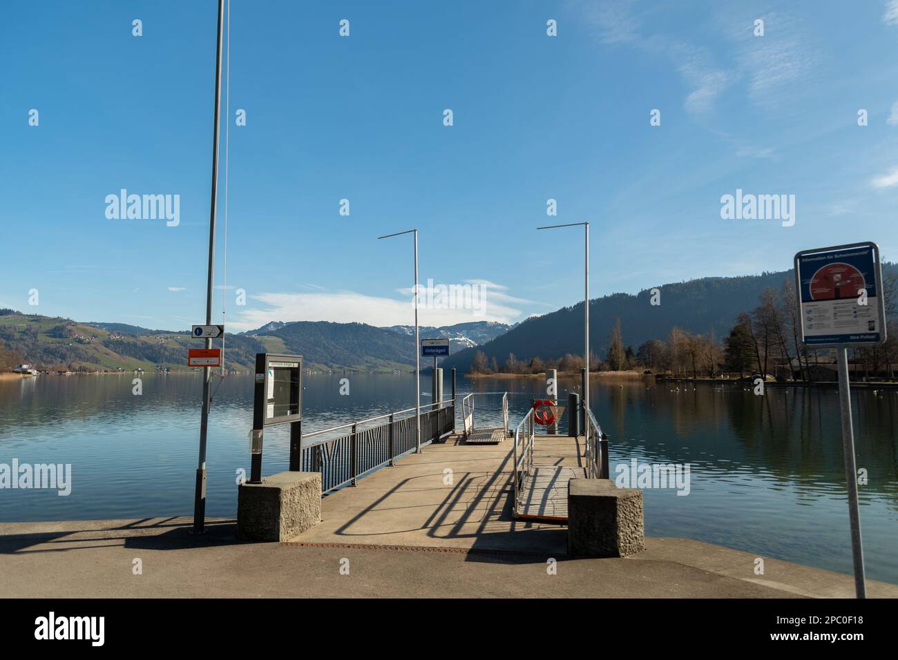 unteraegeri-switzerland-february-20-2023-boat-pier-at-the-coast-of