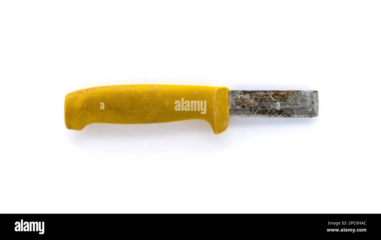 Rusty and worn chisel knife, used tool isolated on white background Stock Photo