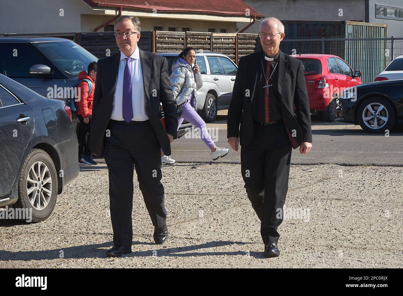 Bucharest, Romania. 13th Mar, 2023: The Most Reverend Justin Welby, Archbishop of Canterbury (R), arrives accompanied by Andrew Noble LVO (L), British Ambassador to Romaniavisit, at the UNHCR integrated center for Ukrainian refugees due to the Russian invasion of Ukraine, at the Romexpo exhibition centre. During the three-day visit in Romania the Archbishop will have several high-level meetings with Her Majesty Margareta, Custodian of the Romanian Crown, the Romanian Patriarch Daniel and politicians. Credit: Lucian Alecu/Alamy Live News Stock Photo