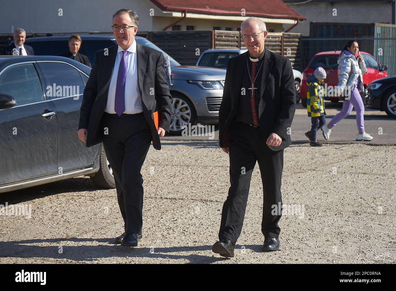 Bucharest, Romania. 13th Mar, 2023: The Most Reverend Justin Welby, Archbishop of Canterbury (R), arrives accompanied by Andrew Noble LVO (L), British Ambassador to Romaniavisit, at the UNHCR integrated center for Ukrainian refugees due to the Russian invasion of Ukraine, at the Romexpo exhibition centre. During the three-day visit in Romania the Archbishop will have several high-level meetings with Her Majesty Margareta, Custodian of the Romanian Crown, the Romanian Patriarch Daniel and politicians. Credit: Lucian Alecu/Alamy Live News Stock Photo