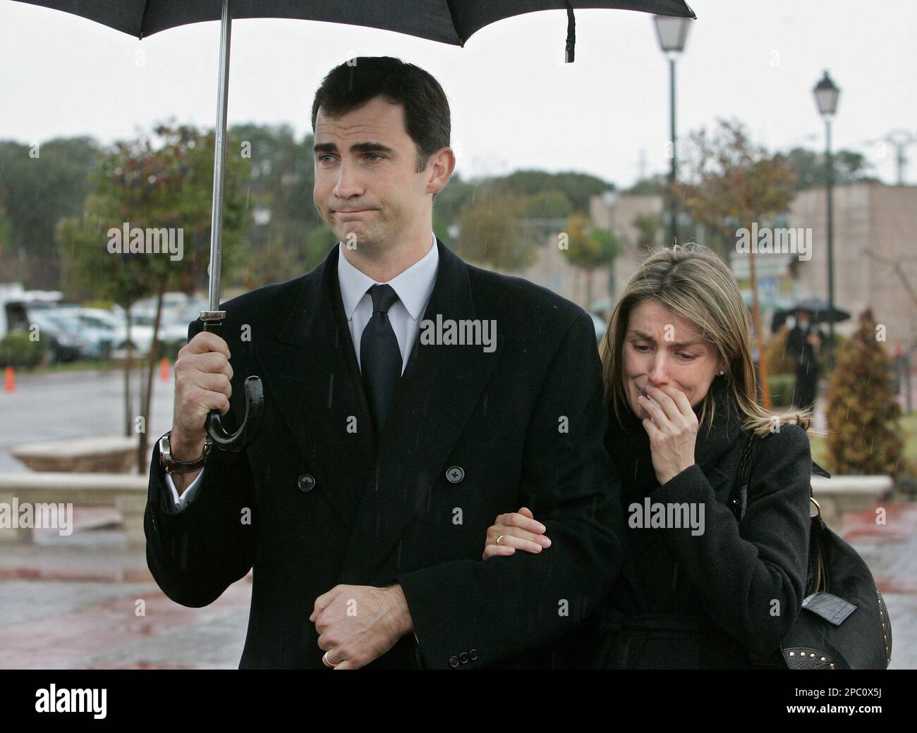 Spain's Crown Princess Letizia, right, accompanied by her husband Crown  Prince Felipe, cries as she remembers her sister Erika Ortiz, after  attending her youngest sister's cremation at La Paz cemetery in Madrid,