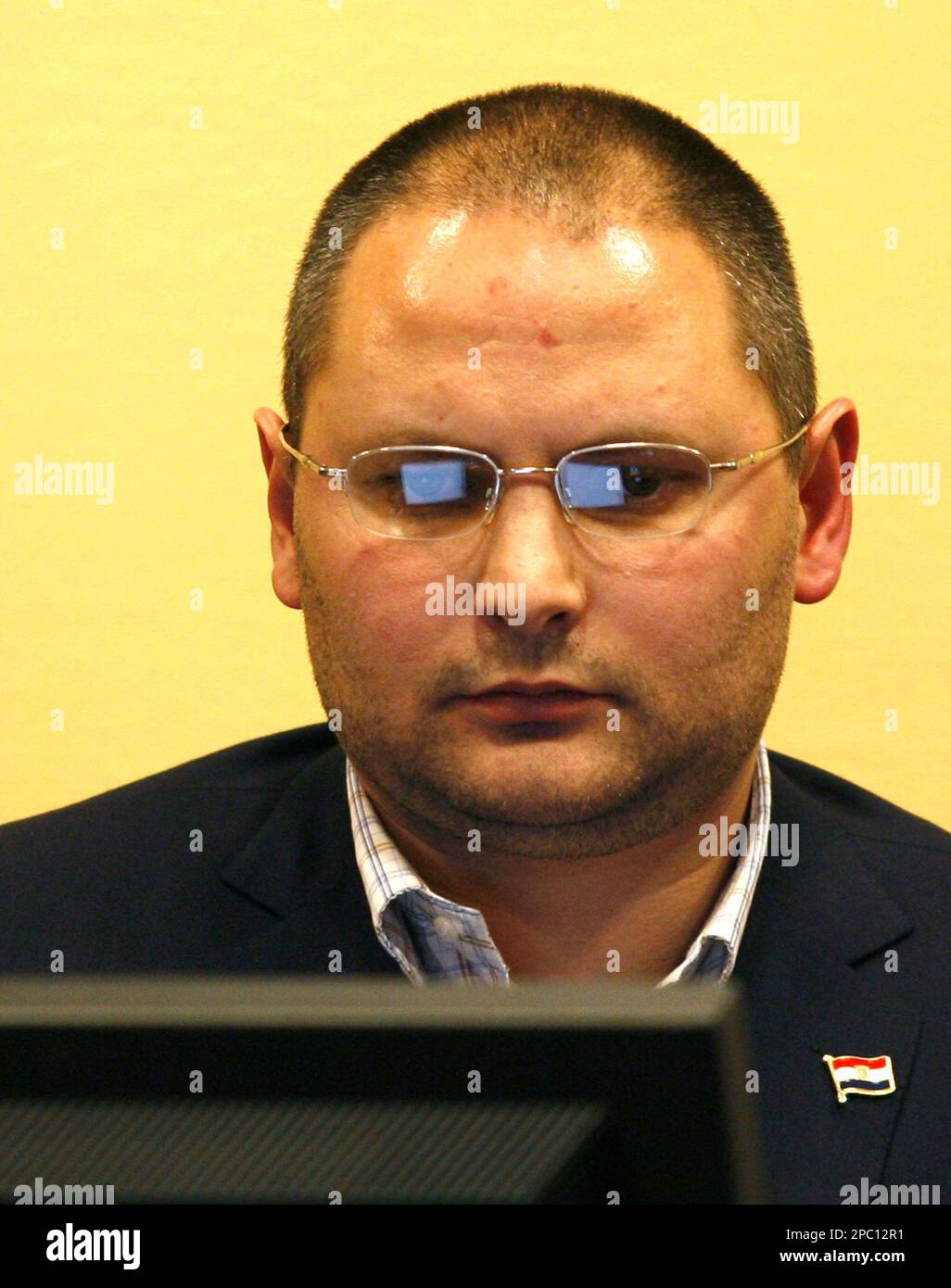 Croatian journalist Domagoj Margetic awaits the verdict of his contempt of court case at the Yugoslav war crimes tribunal (ICTY) in The Hague, Netherlands, Wednesday, Feb. 7, 2007. The Yugoslav war crimes tribunal sentenced Margetic to three months in prison Wednesday for publishing the names of protected witnesses on his Web site, a move prosecutors say damaged their efforts to shield people who testify at the U.N. court. Margetic was also fined euro10,000 (US$13,000) after being found guilty of contempt of court. "Journalists are free to report and comment on all proceedings before the tribu Stock Photo
