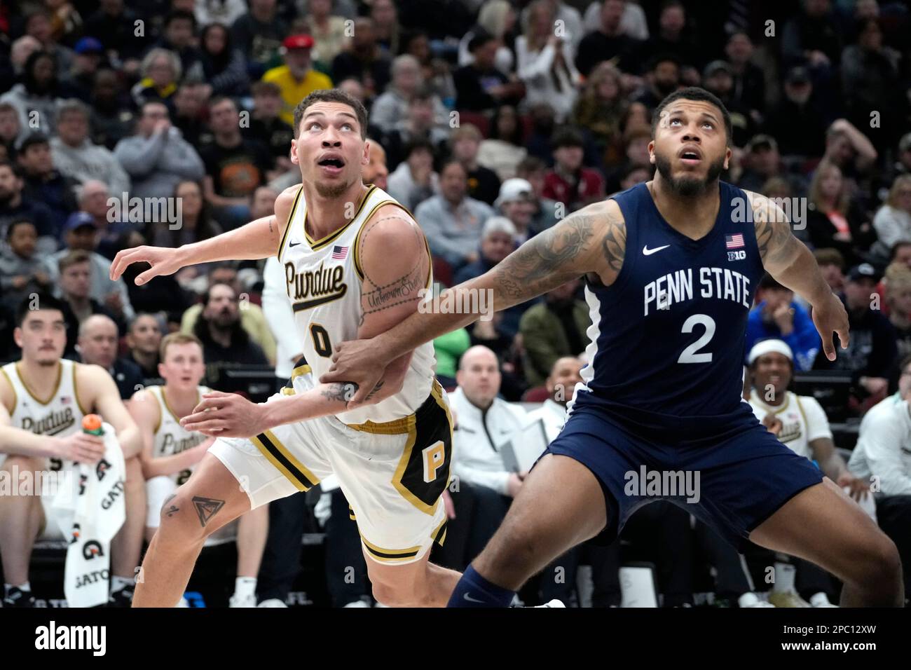 Purdue's Mason Gillis, left, maneuvers around the blockout of Penn