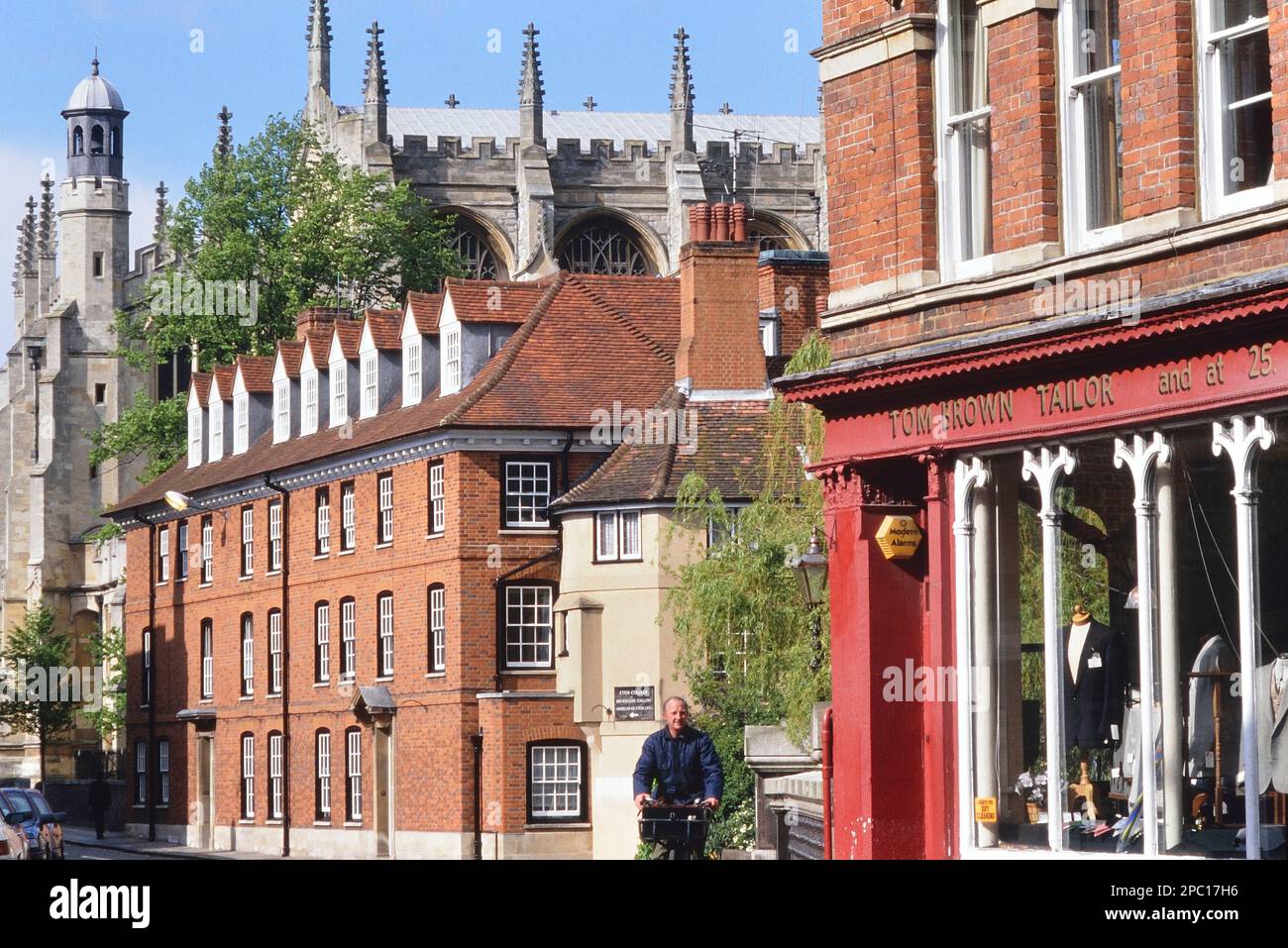 The High Street featuring Tom Brown Tailors and Eton College Chapel, Eton near Windsor, Berkshire, England. Circa 1990's Stock Photo