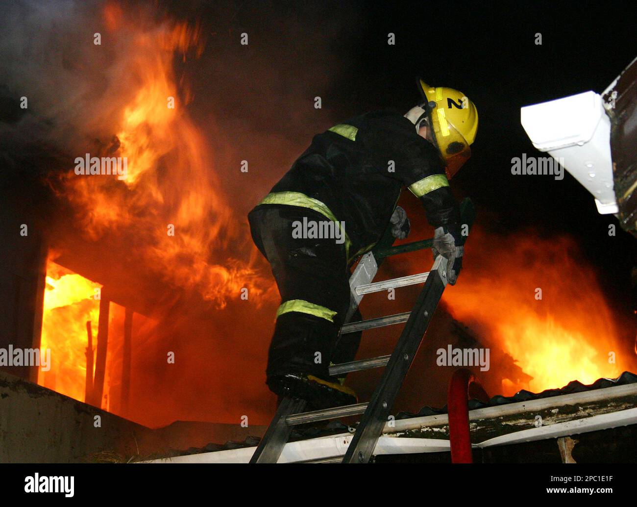 Firemen battle a blaze in the Blue House hotel in Punta Arenas, Chile,  Saturday, Feb. 3, 2007. Ten tourists from Argentina, Germany and the  Netherlands were reported dead.(AP Photo/Diario La Prensa Austral