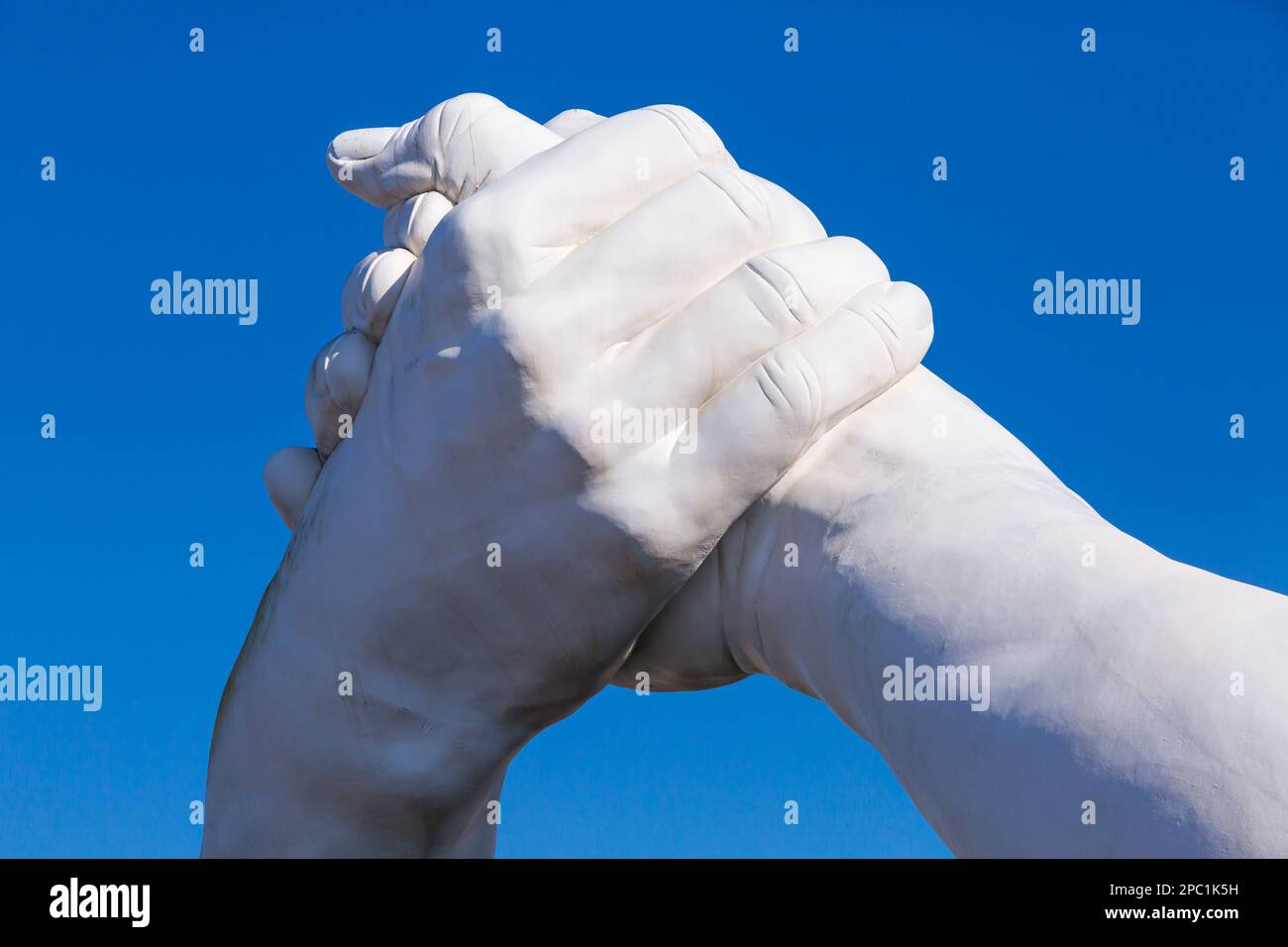 part of Building Bridges sculpture by artist Lorenzo Quinn depicting pairs of monumental hands at Venice, Italy Stock Photo