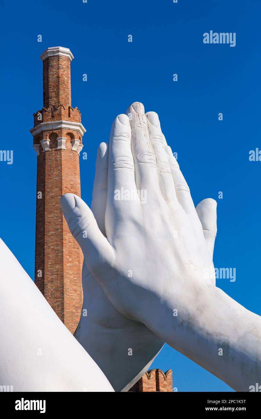 part of Building Bridges sculpture by artist Lorenzo Quinn depicting pairs of monumental hands at Venice, Italy Stock Photo