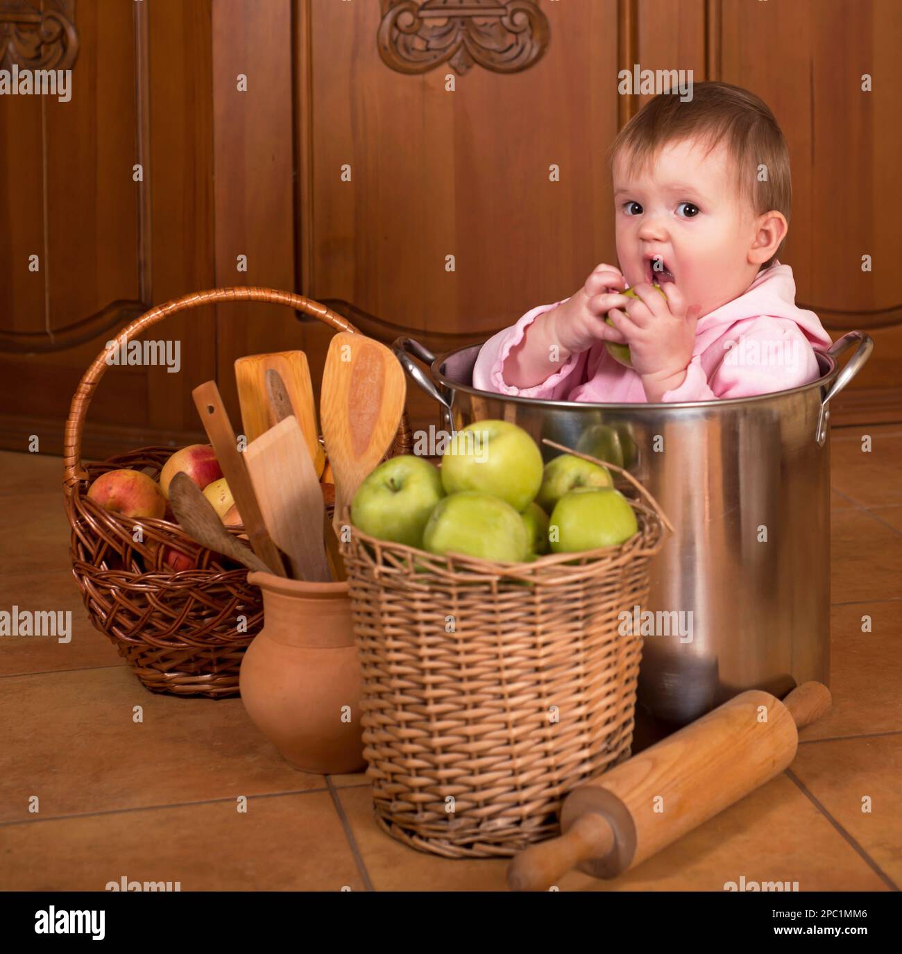 baby with big cooking pot Stock Photo