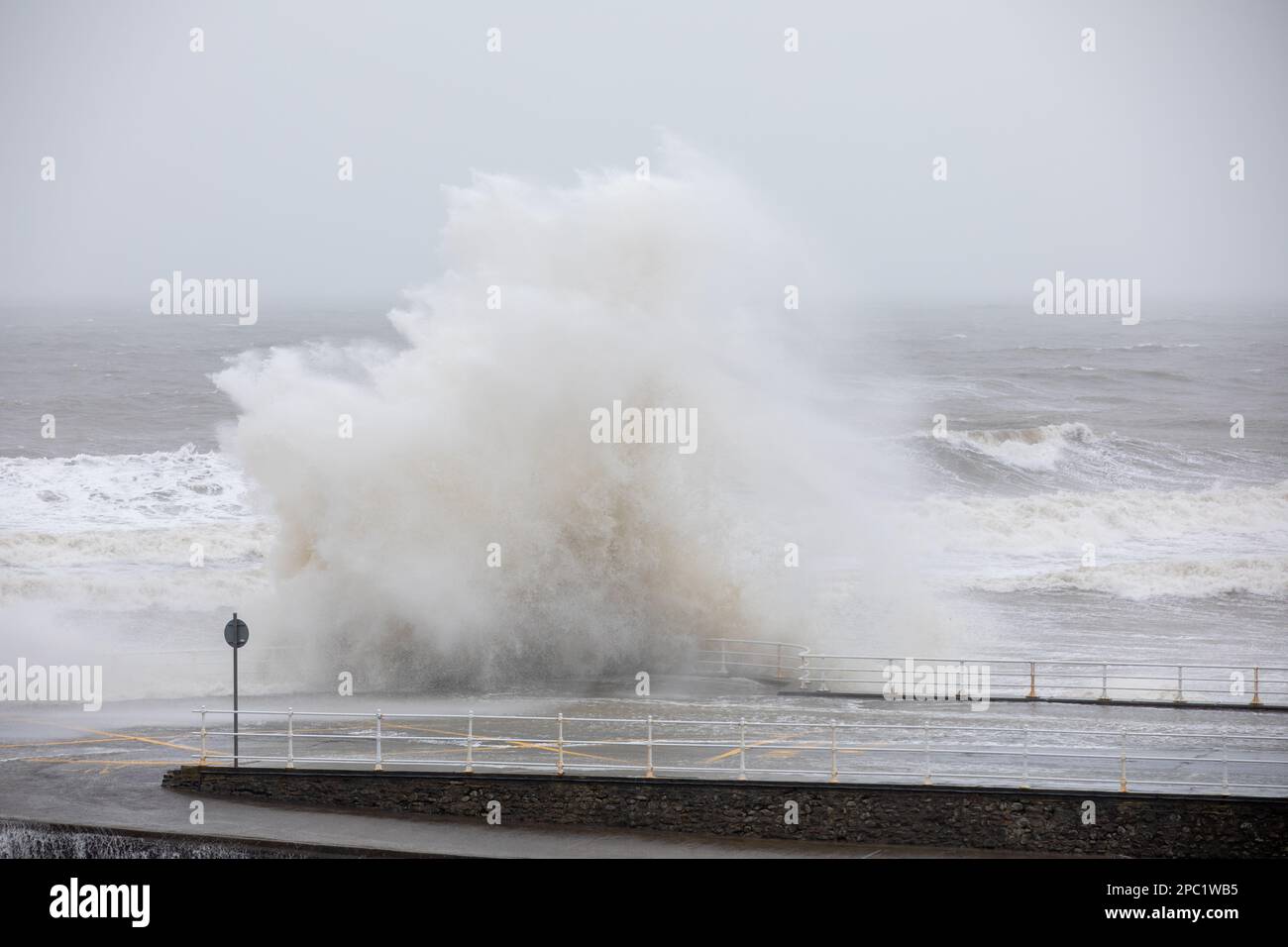 Aberystwyth, Ceredigion, Wales, UK. 13th March 2023 UK Weather: Strong winds, combined with incoming high tide brings large crashing waves along Aberystwyth sea defences this morning. © Ian Jones/Alamy Live News Stock Photo