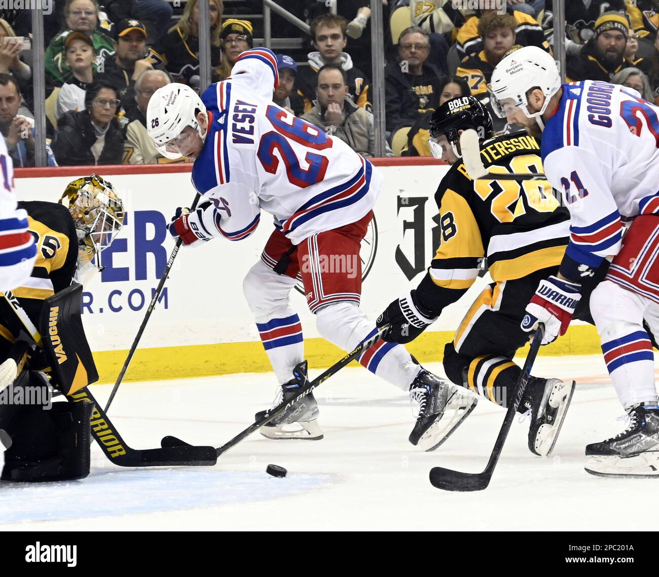 Pittsburgh, United States. 12th Mar, 2023. New York Rangers left wing Jimmy Vesey (26) passes the puck in front of Pittsburgh Penguins goaltender Tristan Jarry (35) to New York Rangers center Barclay Goodrow (21) who shoots and scores in the first period at PPG Paints Arena in Pittsburgh on Sunday, March 12, 2023. Photo by Archie Carpenter/UPI Credit: UPI/Alamy Live News Stock Photo