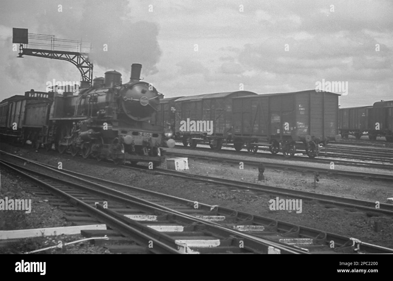 A Nord (later SNCF) 4-6-0 steam locomotive of the 230D class hauls a train near Calais Stock Photo