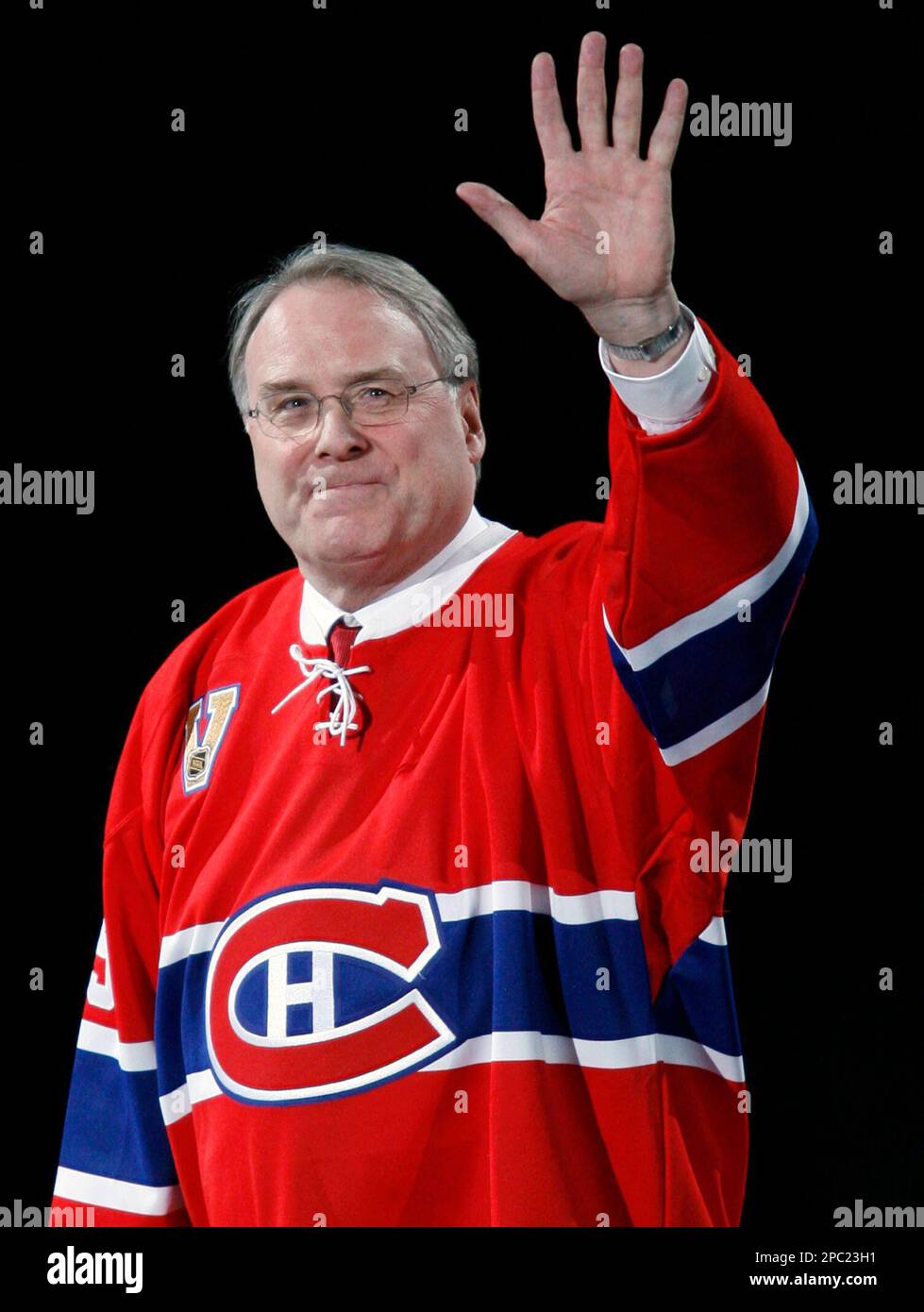 Former Montreal Canadiens goaltender Ken Dryden is applauded by Canadiens  Cristobal Huet, Saku Koivu and Christopher Higgins, left to right, as he is  introduced at the Bell Centre as his jersey is