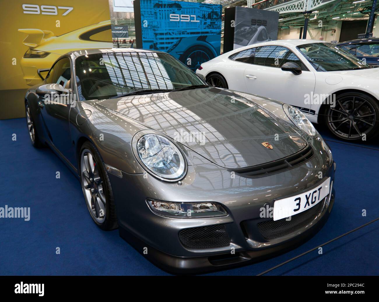 Three-quarters Front View of a 2007, Porsche 997, part of a special celebration of 60 years of his famous marque, at the 2023 London Classic Car Show Stock Photo