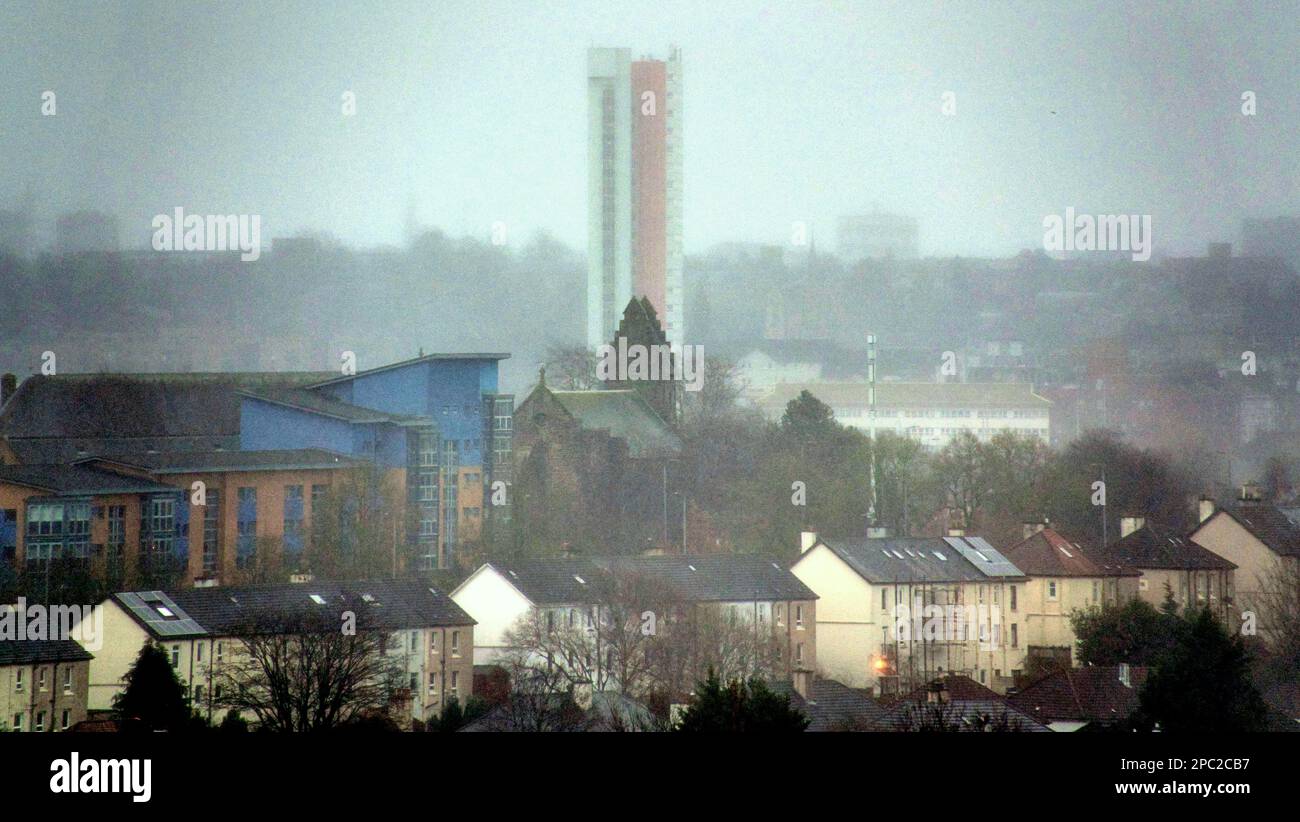 Glasgow, Scotland, UK 13th March, 2023. UK Weather: Snow and sleet pours in as the city disappears behind the Anniesland  tower the highest listed building in scotland. Credit Gerard Ferry/Alamy Live News Stock Photo