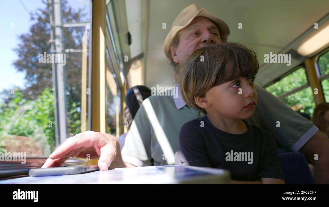 Grandparent traveling by train with grandchild. Two different ...
