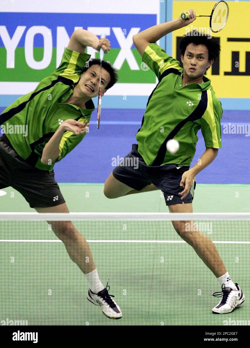 Tony Gunawan of the United States, left, and Candra Wijaya of Indonesia, right, return the shuttlecock against China during the mens doubles quarterfinals in the 2007 Yonex Korea Open Badminton Super Series