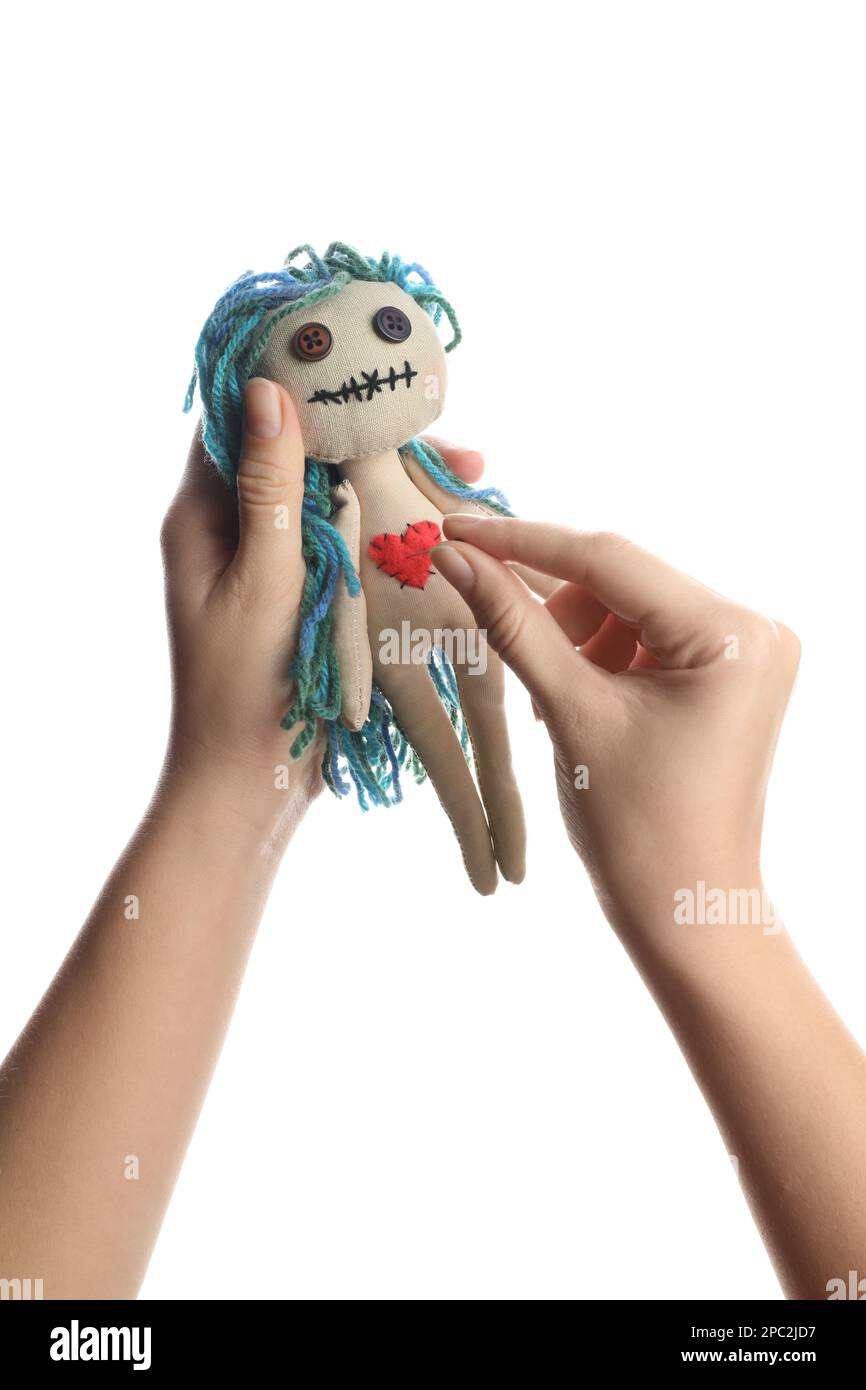 Woman stabbing voodoo doll with pin on white background, closeup Stock ...