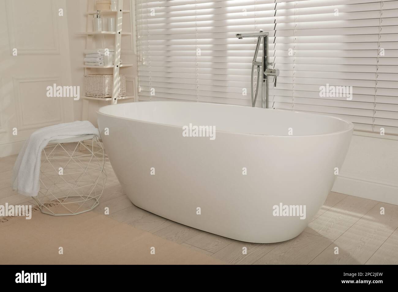 Minimal bathroom interior with modern white tub Stock Photo - Alamy