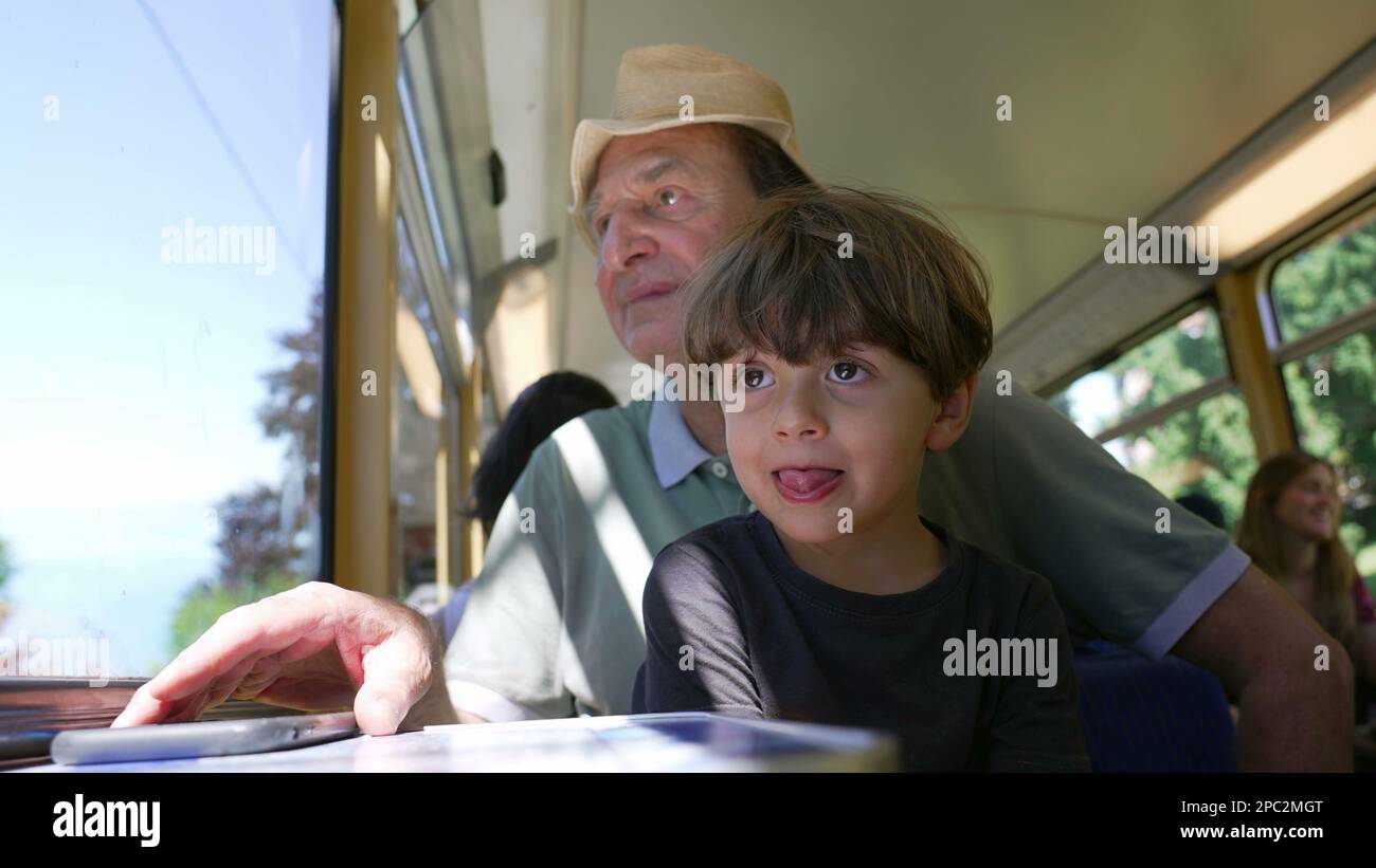 Grandparent traveling by train with grandchild. Two different ...
