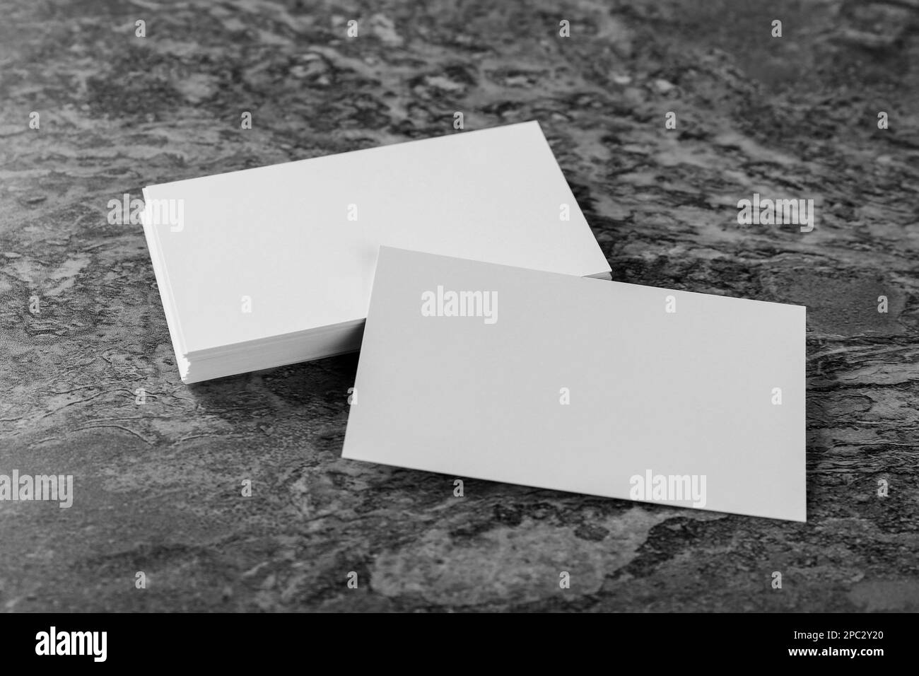 Blank business cards on grey background. Mockup for design Stock Photo