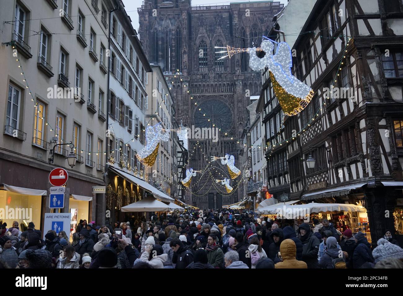 Christmas holiday in Strasbourg, France, Dec 2022. It was very cold weather, minus eight degrees Celcius. Notredame cathedral in the background. Stock Photo
