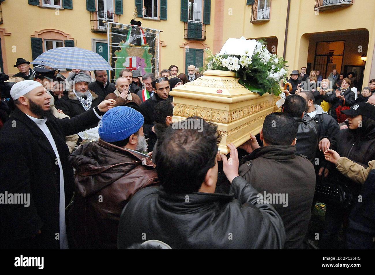 People carry a coffin during a ceremony to honor the death of Raffaella ...