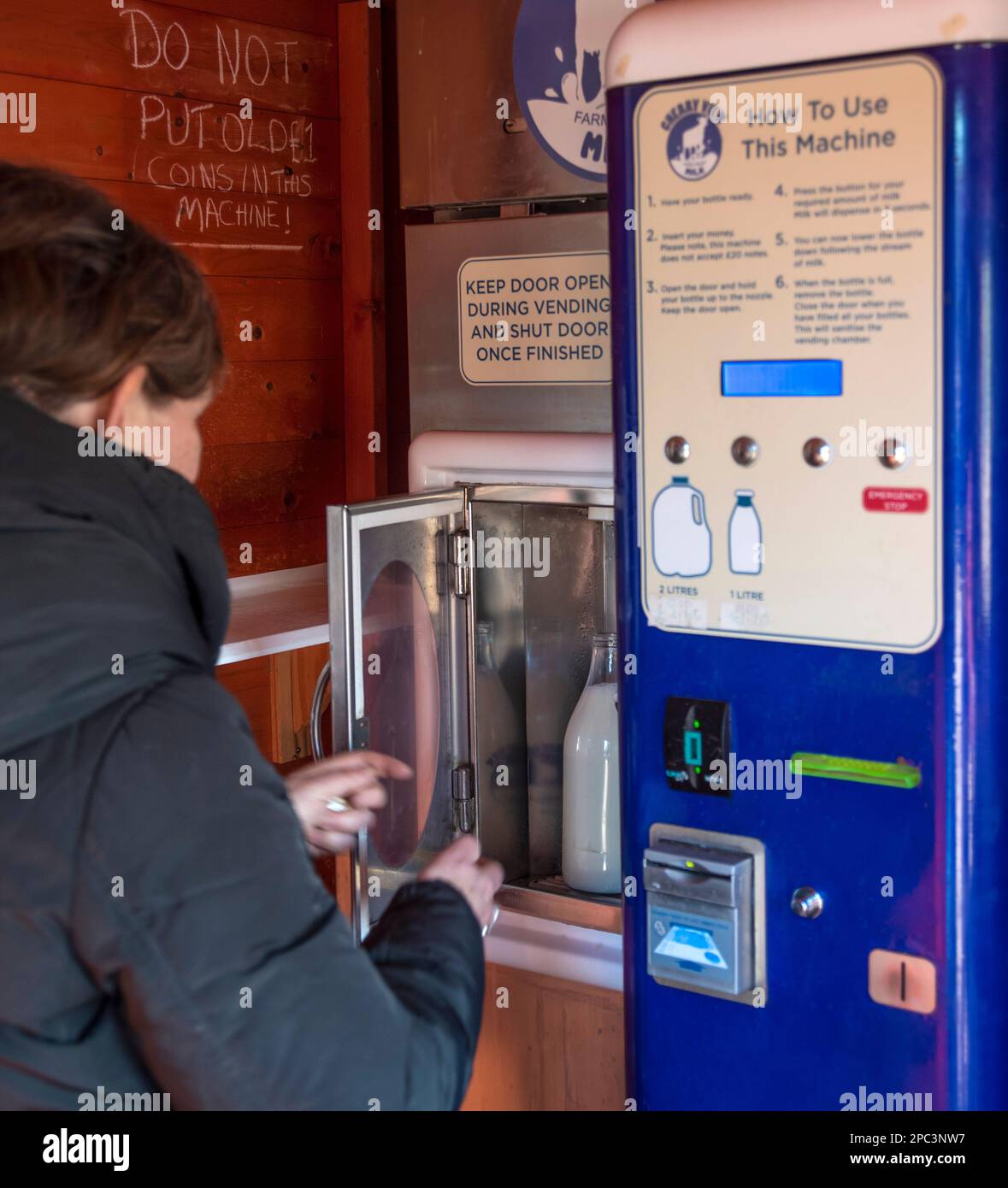 A fresh milk vending machine on a dairy farm means the farm get a decent payment for their milk by cutting out the supermarkets. Stock Photo