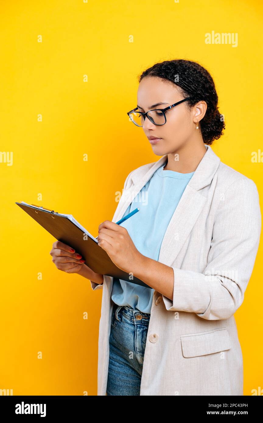 Focused professional woman holds hi-res stock photography and images ...