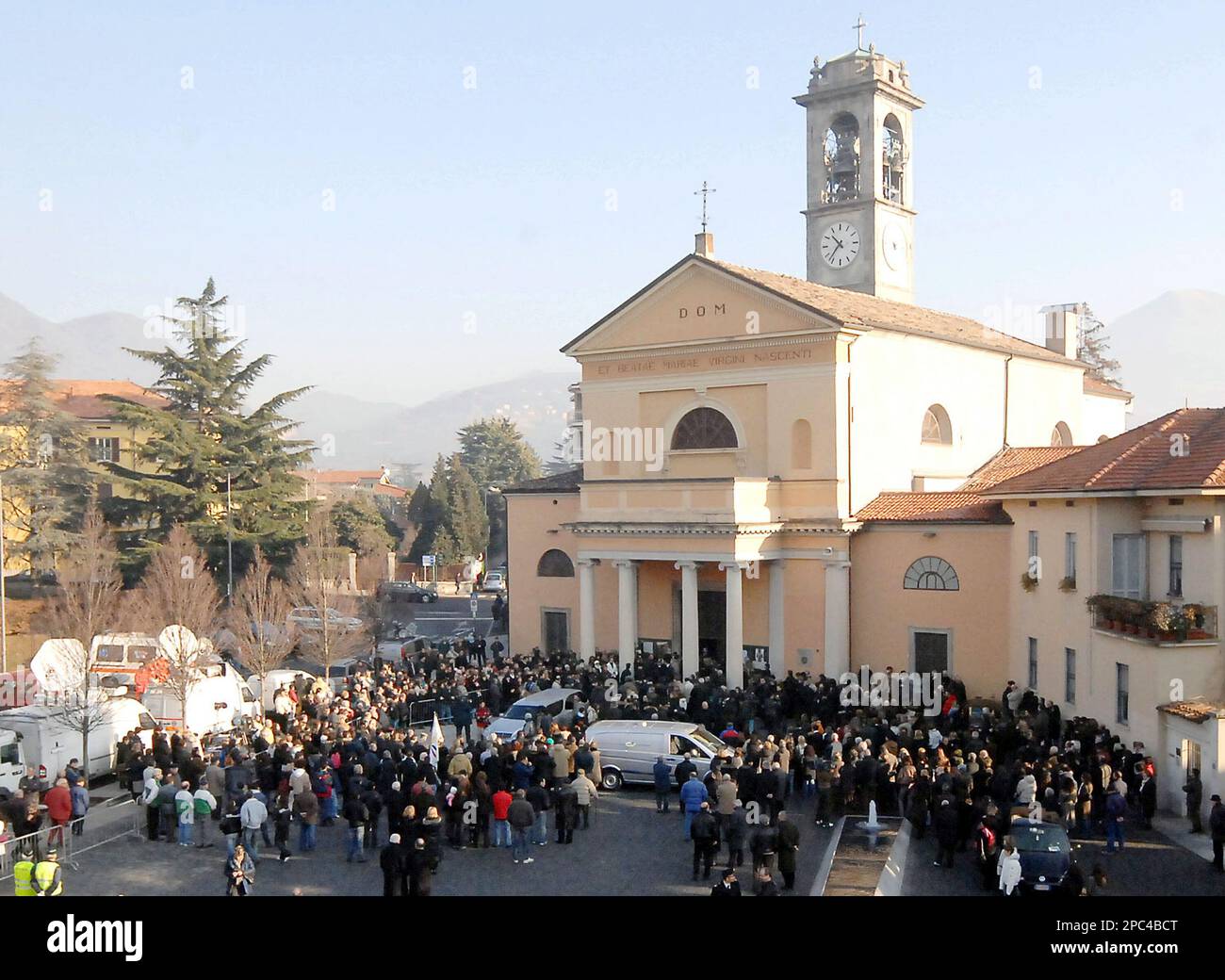 People gather outside S.Maria Nascente church during the funeral service of  Paola Galli in Erba, Italy, Saturday, Jan. 13, 2007. Paola Galli was killed  Dec. 11, along with her daughter Raffaella her