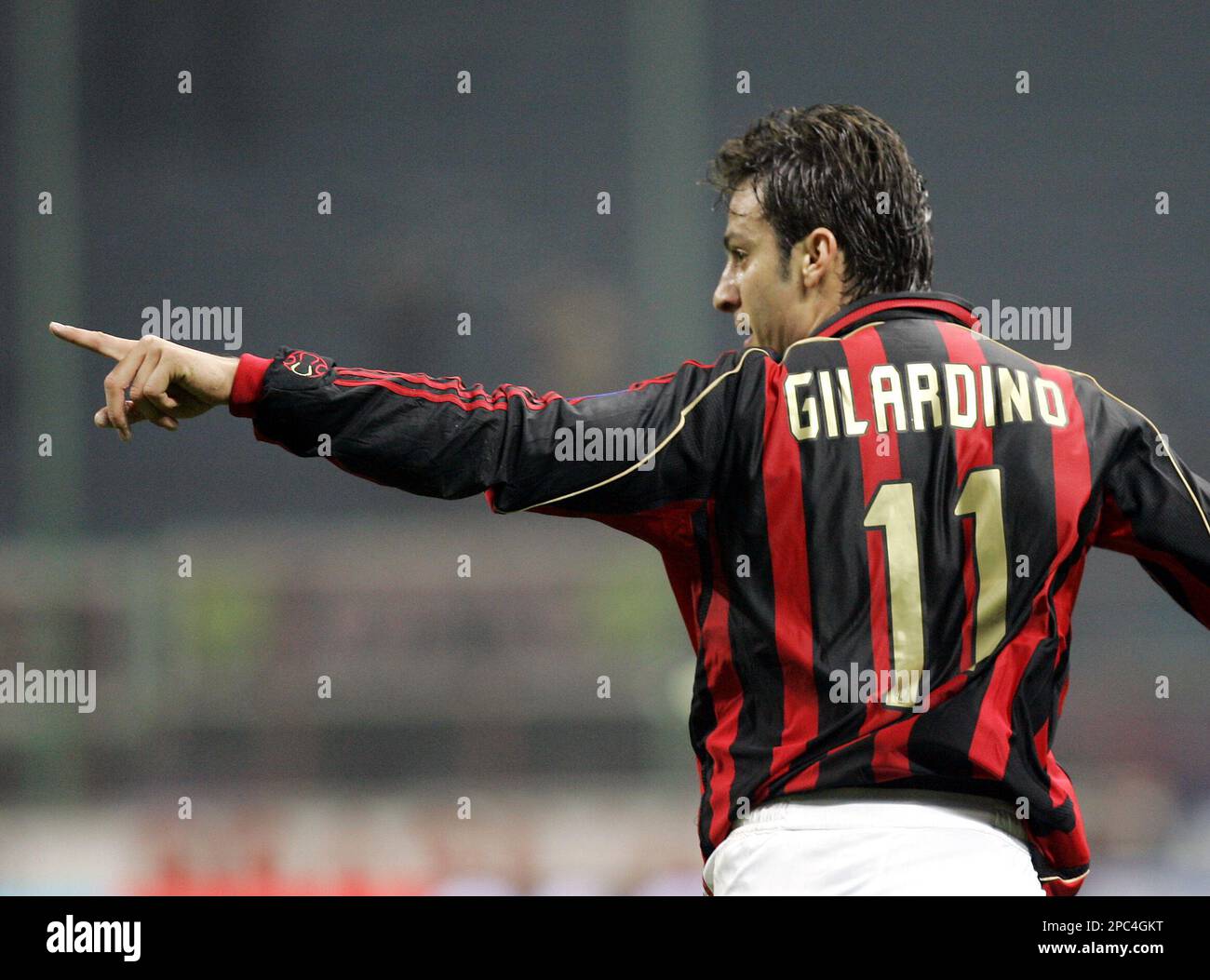 AC Milan forward Alberto Gilardino celebrates after scoring during