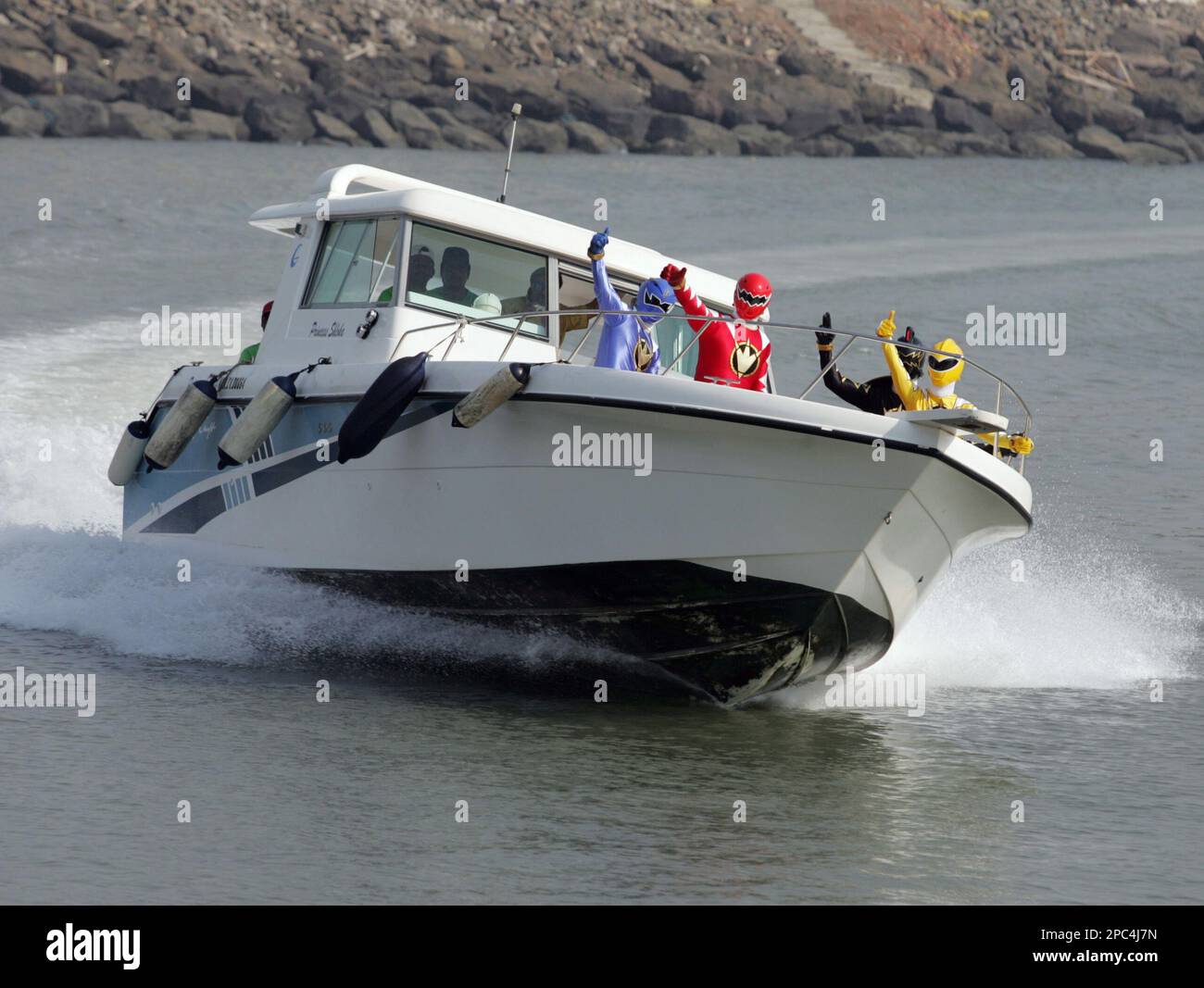 Walt Disney characters called Power Rangers arrive by speed boat at the ...