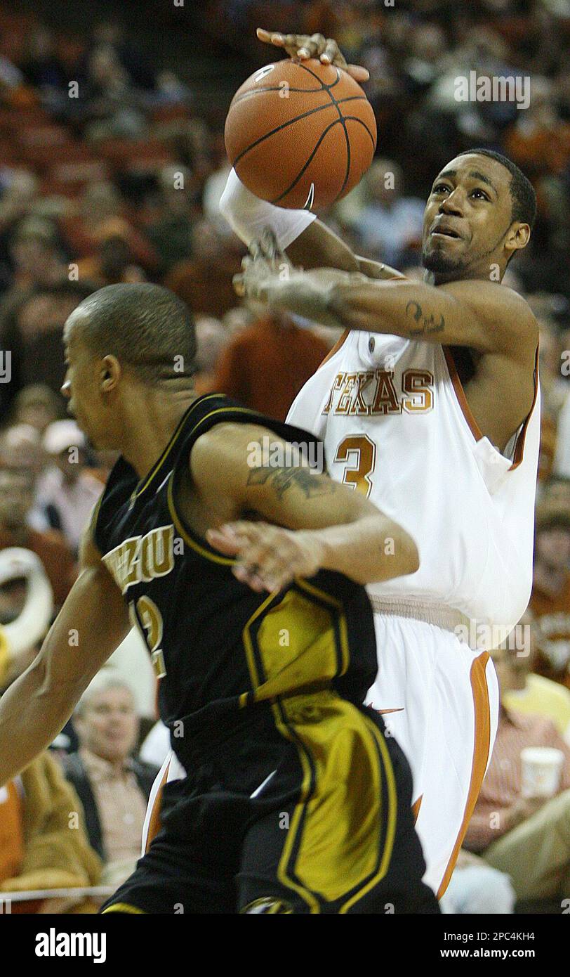Texas' A.J. Abrams, right, loses control of the ball against the