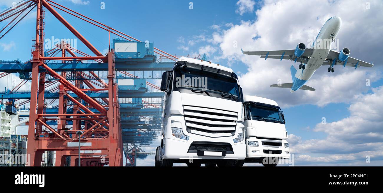Airplane in the sky above the crane and trucks in the seaport. World trade and transportation concept Stock Photo
