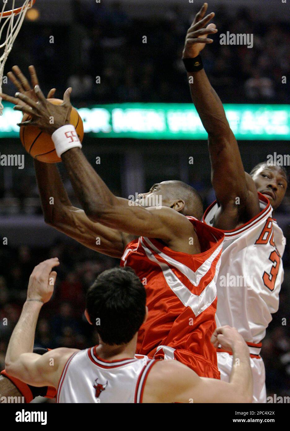 Mutamba Houston Rockets Houston Rockets center Dikembe Mutombo, center, rebounds the ball ...