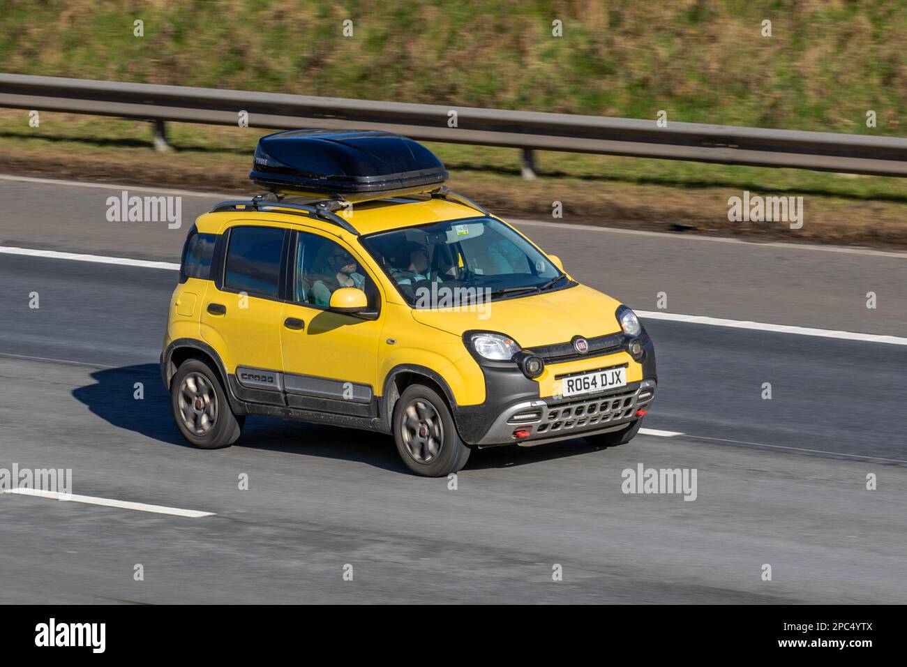 2014 Yellow FIAT PANDA TWINAIR 875cc Petrol 6 speed manual; travelling on the M61 motorway, UK Stock Photo