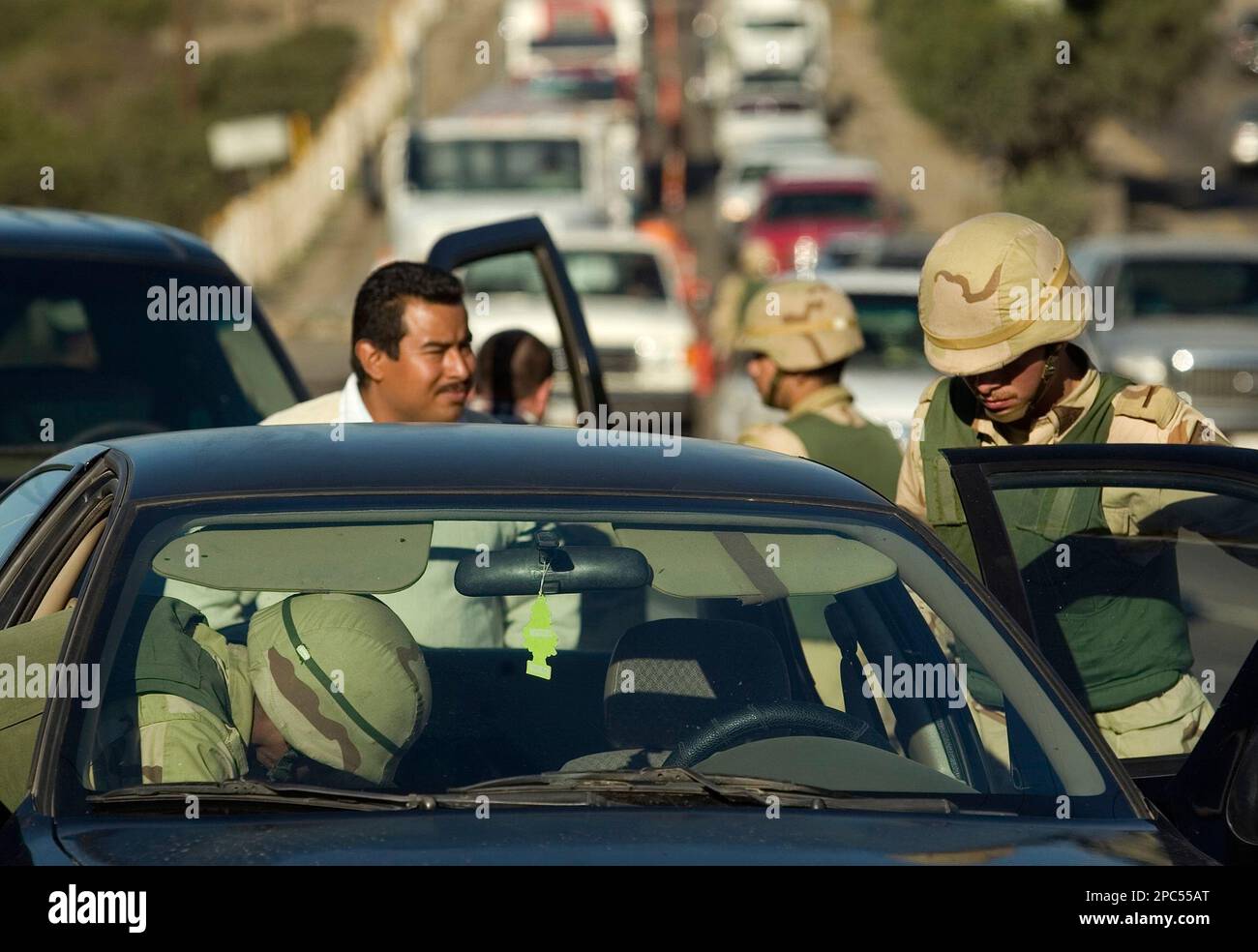 Tijuana Checkpoint Mexican soldiers check a vehicle in a checkpoint on the outskirts of ...