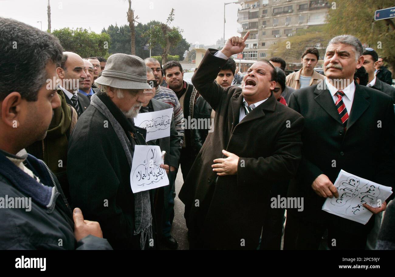 Ahmad al-Fadhali, center-right, shouts as he and others protest the ...