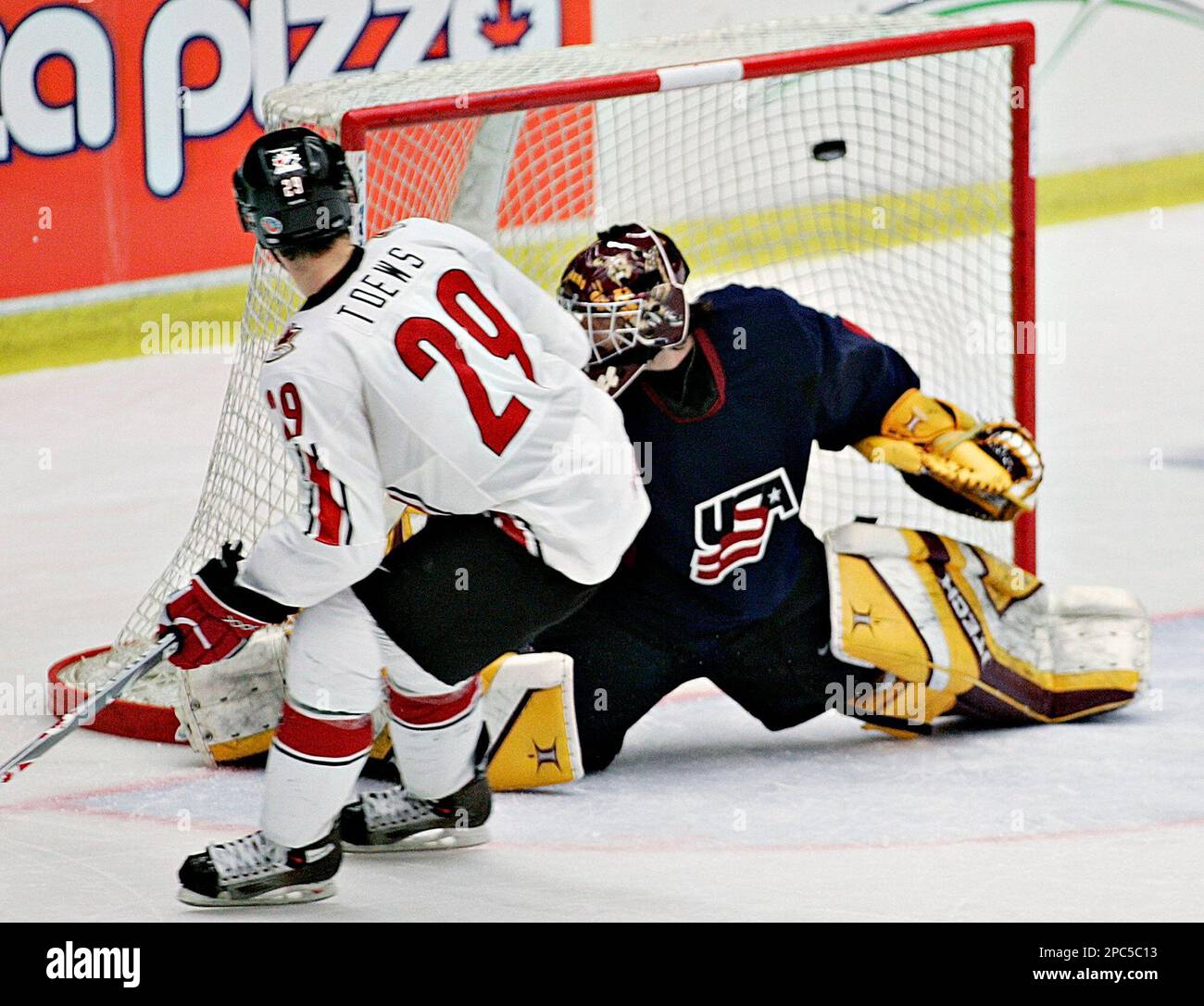 Team Canadas Jonathan Toews (29) scores the winning goal in a shootout against team USA goalie Jeff Frazee during semi-final game action at the World U20 hockey championship Wednesday, Jan
