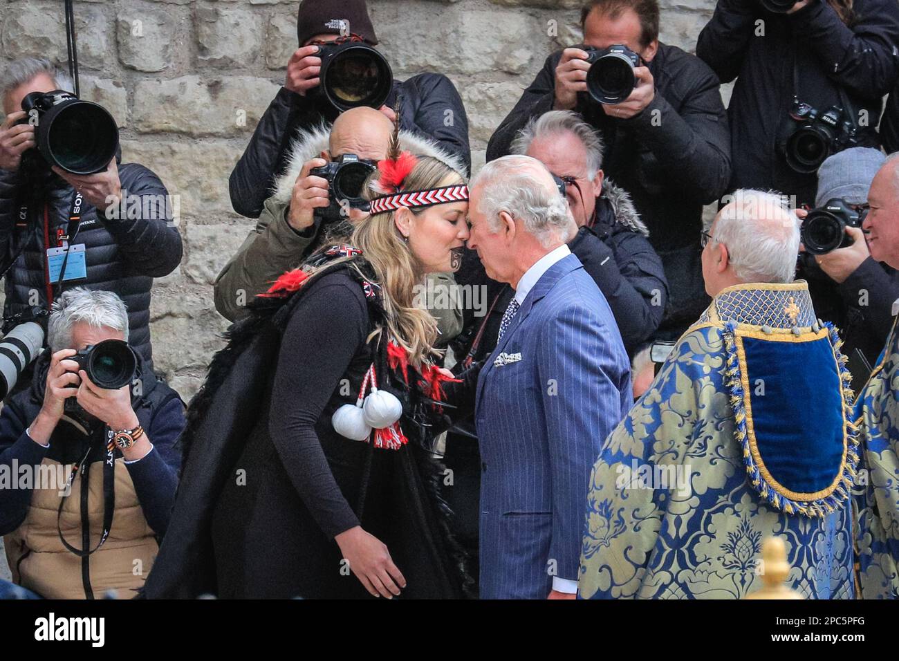 London, UK. 13th Mar, 2023. The King greets Reanne Pomtana (Ngati Ranana London Maori Club) at Westminster Abbey with the hongi, a traditional Maori greeting, by pressing the nose and forehead together. King Charles and Camilla, the Queen Consort. Politicians, Royals and guests arrive and depart form today's Commonwealth Service held at Westminster Abbey in central London Credit: Imageplotter/Alamy Live News Stock Photo