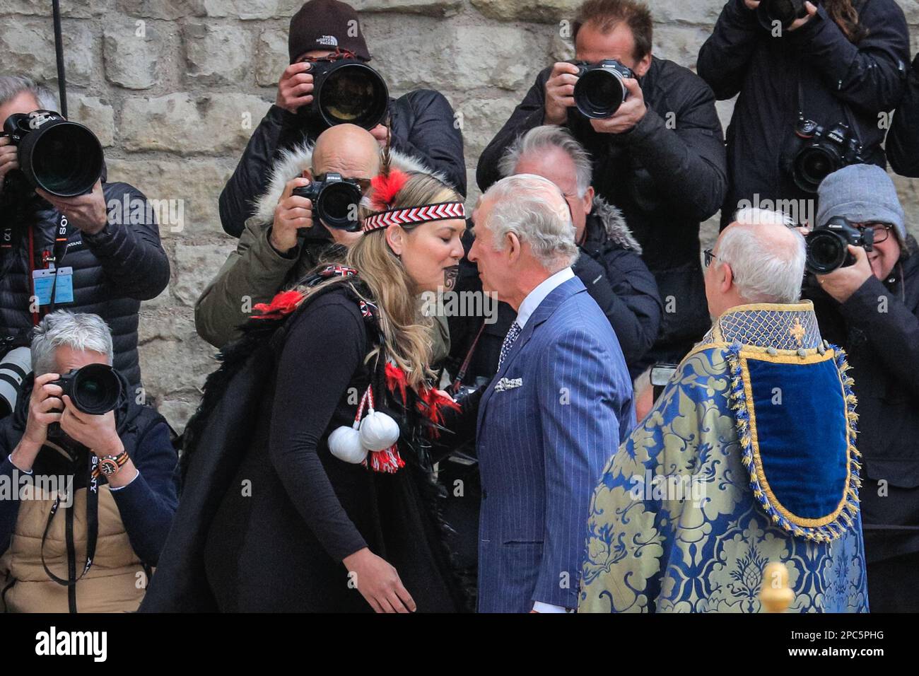 London, UK. 13th Mar, 2023. The King greets Reanne Pomtana (Ngati Ranana London Maori Club) at Westminster Abbey with the hongi, a traditional Maori greeting, by pressing the nose and forehead together. King Charles and Camilla, the Queen Consort. Politicians, Royals and guests arrive and depart form today's Commonwealth Service held at Westminster Abbey in central London Credit: Imageplotter/Alamy Live News Stock Photo