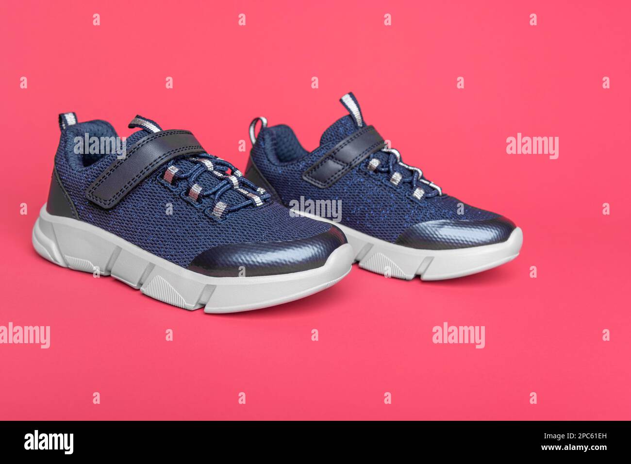 Sneakers on a pink background Stock Photo - Alamy