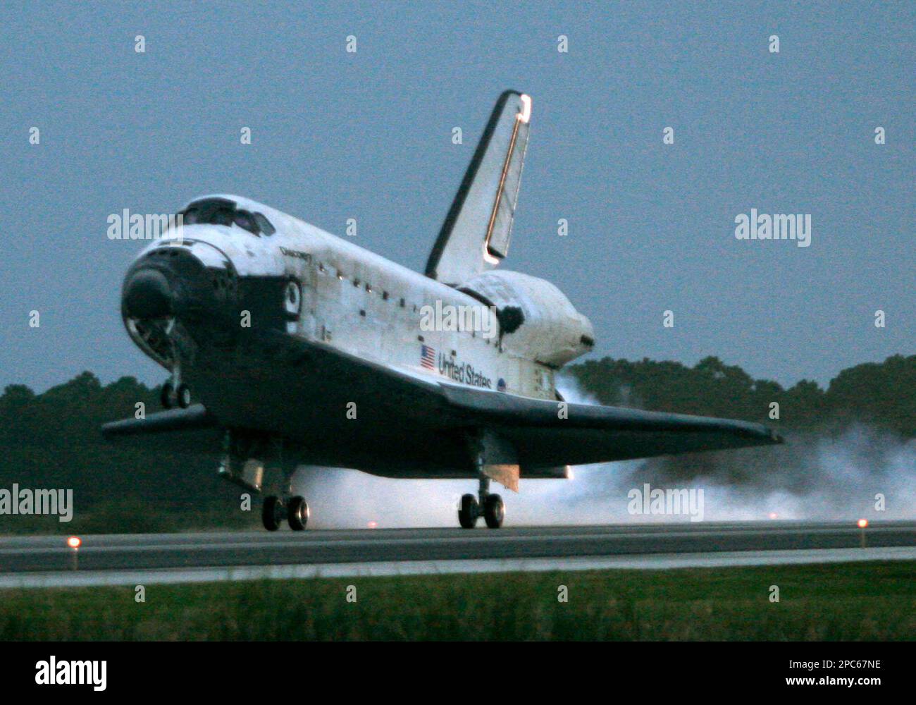 Space Shuttle Discovery lands at the Kennedy Space Center, Fla Friday ...