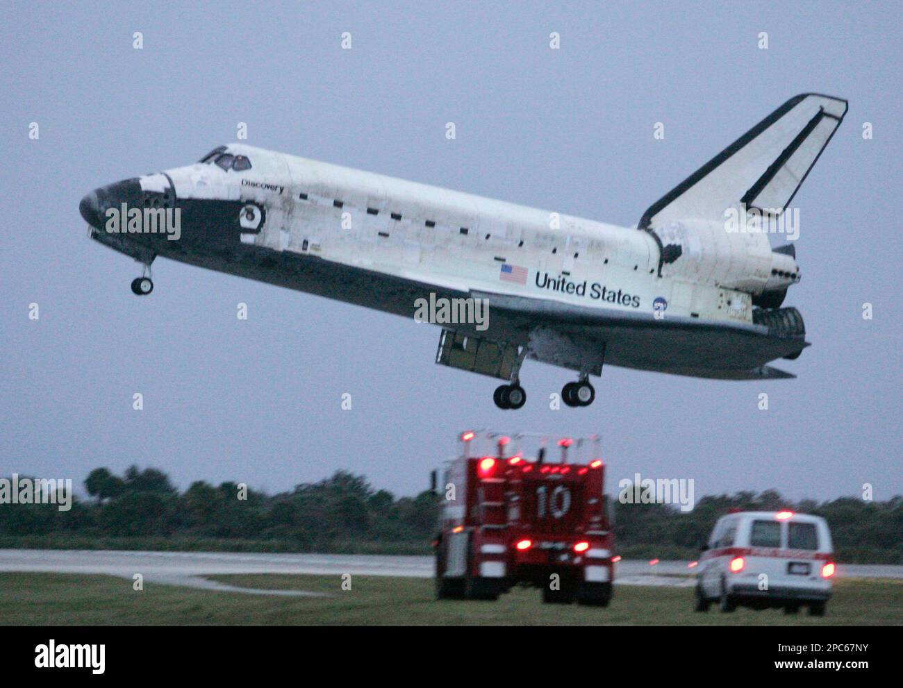 Space Shuttle Discovery lands at Kennedy Space Center, in Cape ...