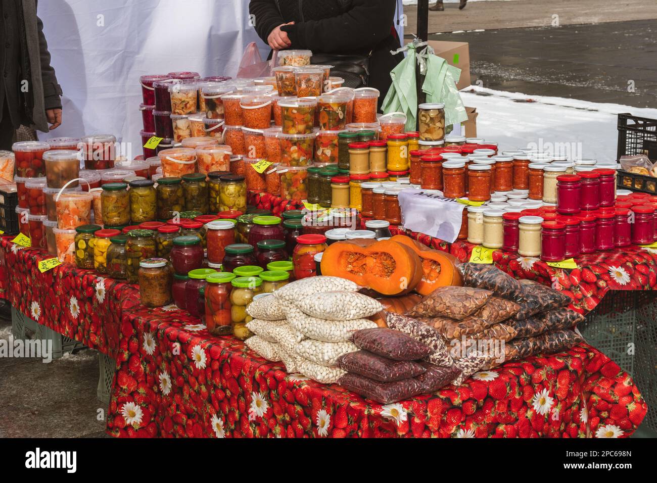 Selling various pickled or marinated vegetables, beans and berries in Kaziuko Muge or Saint Casimir's Fair, a spring annual folk arts and crafts fair Stock Photo