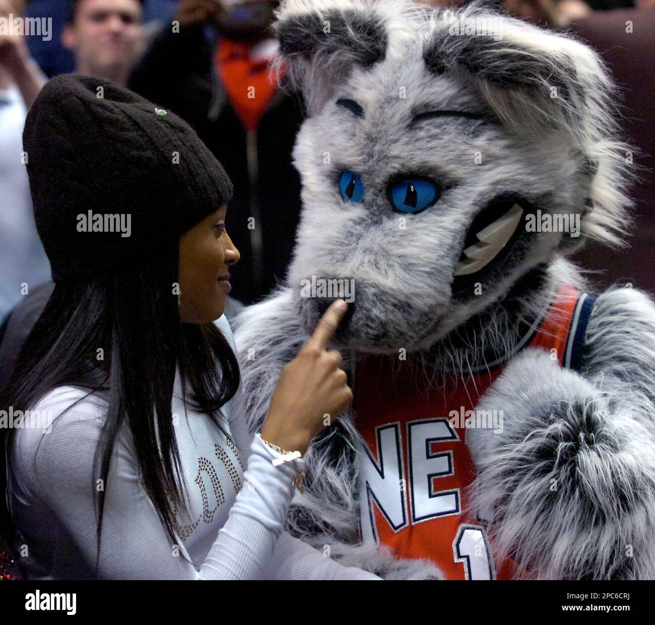 Singer Ciara hugs Sly, the Nets mascot, during NBA basketball Wednesday  night, Dec. 20, 2006 in East Rutherford, N.J. The New Jersey Nets beat the  Cleveland Cavaliers, 113-111. (AP Photo/Bill Kostroun Stock