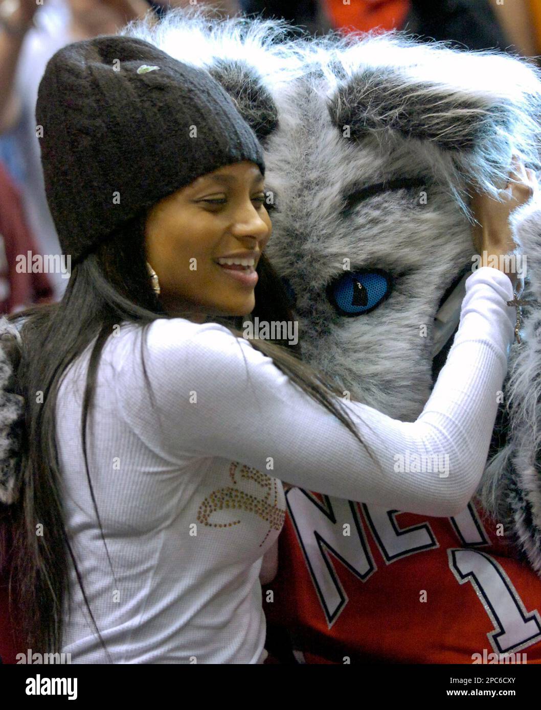 Singer Ciara hugs Sly, the Nets mascot, during NBA basketball Wednesday  night, Dec. 20, 2006 in East Rutherford, N.J. The New Jersey Nets beat the  Cleveland Cavaliers, 113-111. (AP Photo/Bill Kostroun Stock