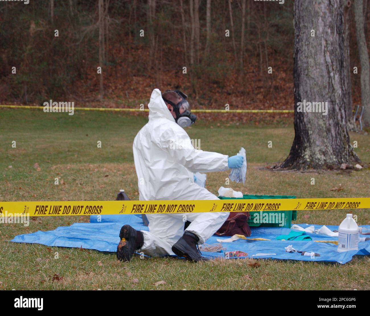 Police sort through evidence on Tuesday, Dec. 19, 2006, found dumped in