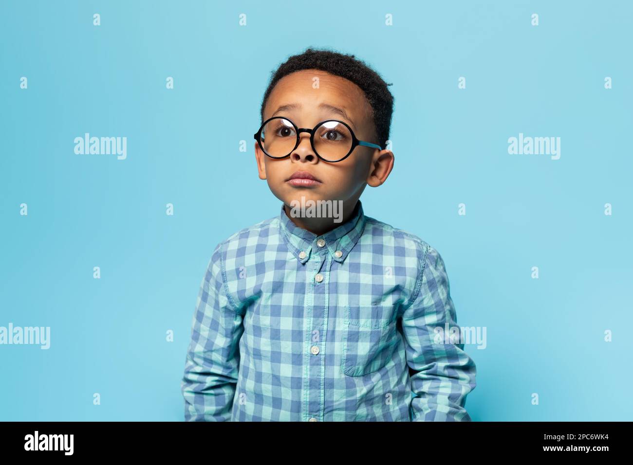 Eyesight. Portrait of black little boy wearing eyeglasses and looking