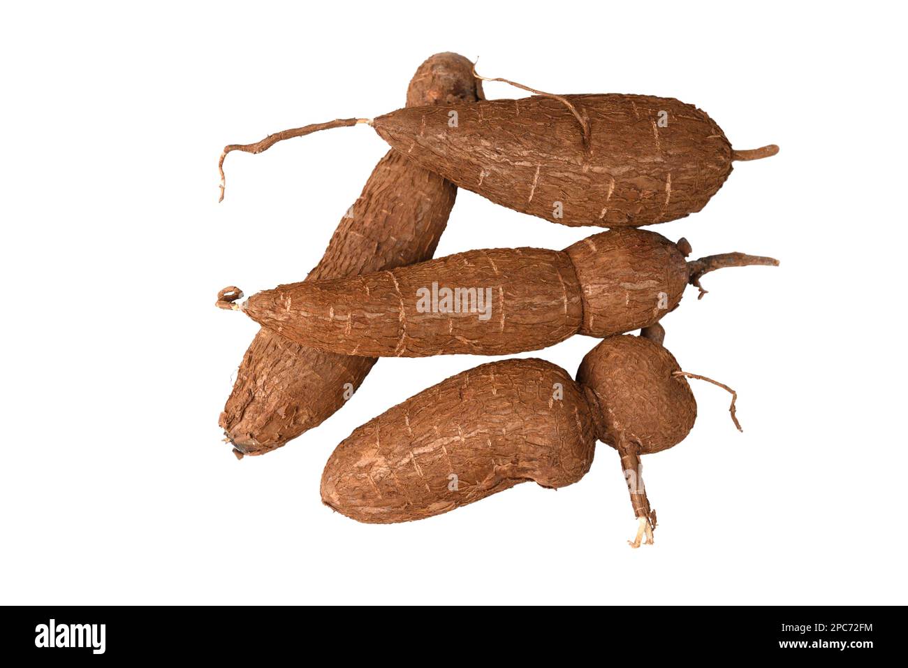 Organic Cassava tuber isolated on white background. View from above. Raw Yucca cassava root. Tropical harvest. Stock Photo