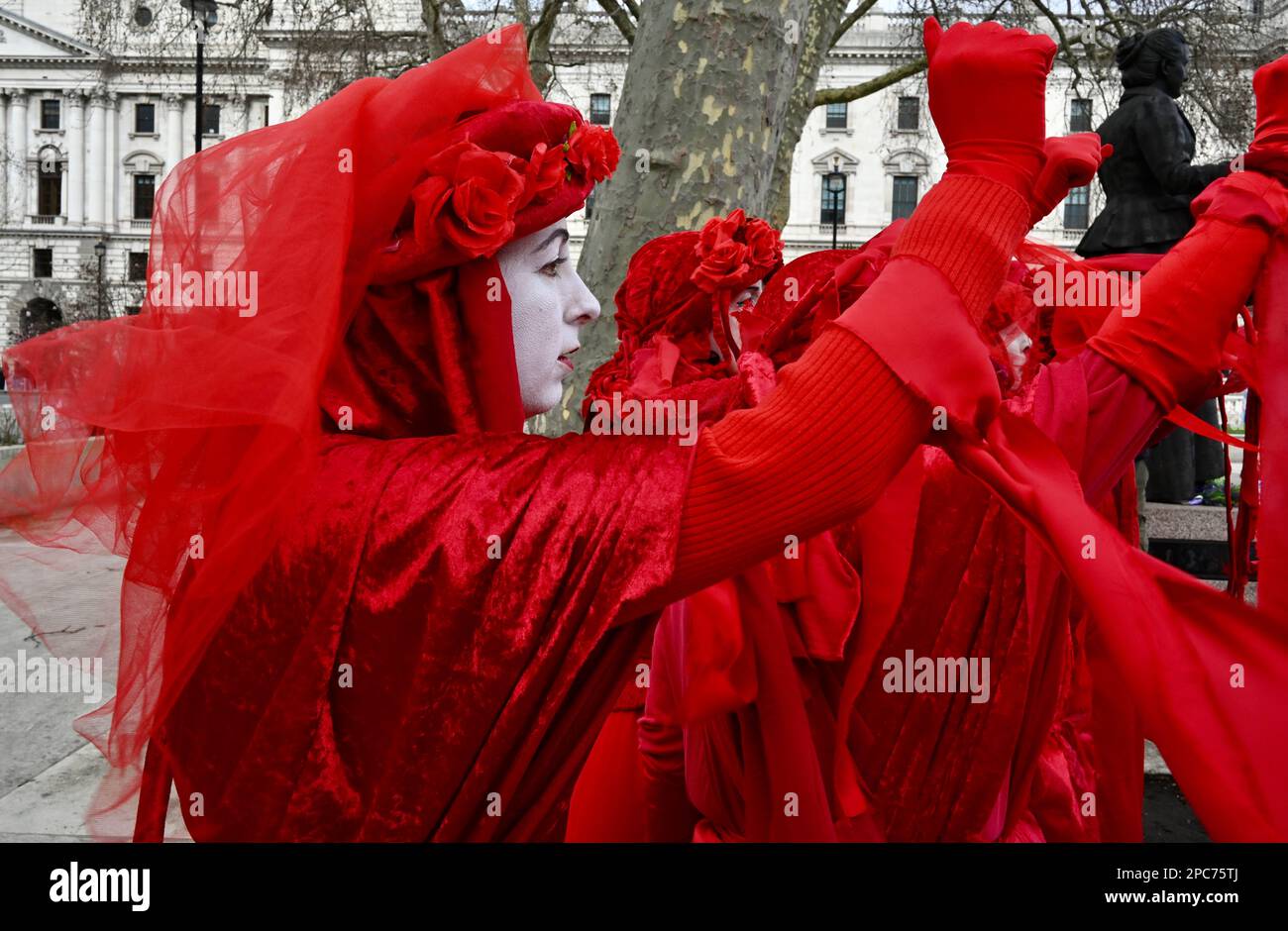 London, UK. Red Rebel Brigade. Extinction Rebellion protested in Parliament Square against the UK Government's blocking of a law that requires water companies to refrain from dumping raw sewage in our waterways and seas. Credit: michael melia/Alamy Live News Stock Photo